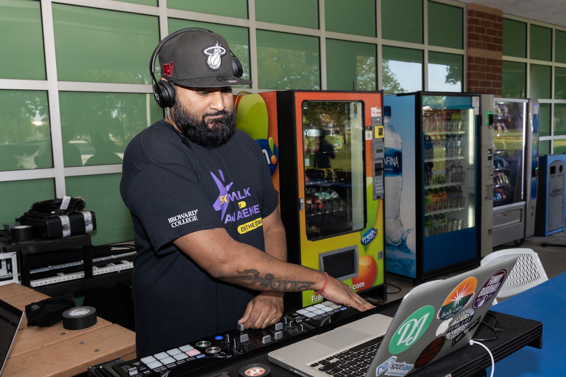 Dj Booz mixing outdoor at party event - South Florida Uplight